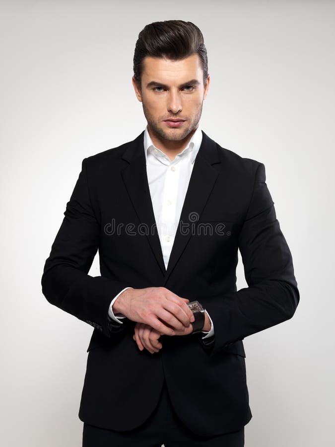 Fashion young businessman in black suit stock images