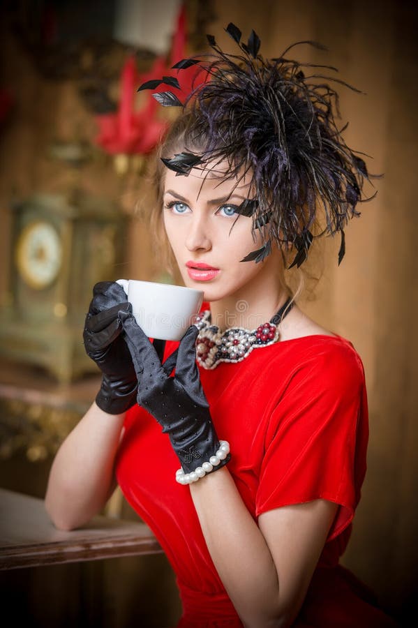 Fashionable Attractive Young Woman in Green Dress Sitting in Restaurant ...