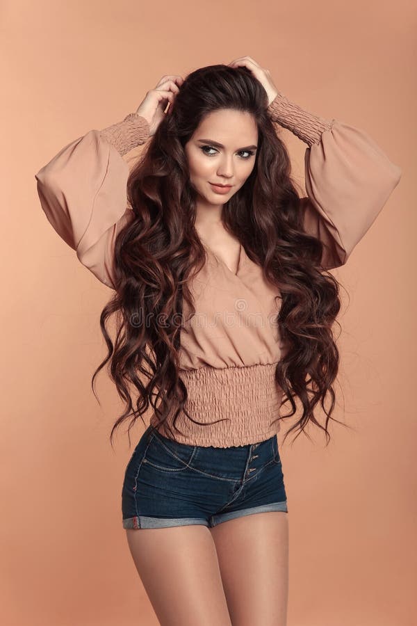 Fashionable Beautiful Girl Wearing Blouse with Long Sleeves and Stock Image - Image of hairstyle, jeans: 132643123 Fashionable Beautiful Girl Wearing Blouse with Long Sleeves and Stock Image - Image of hairstyle, jeans: 132643123