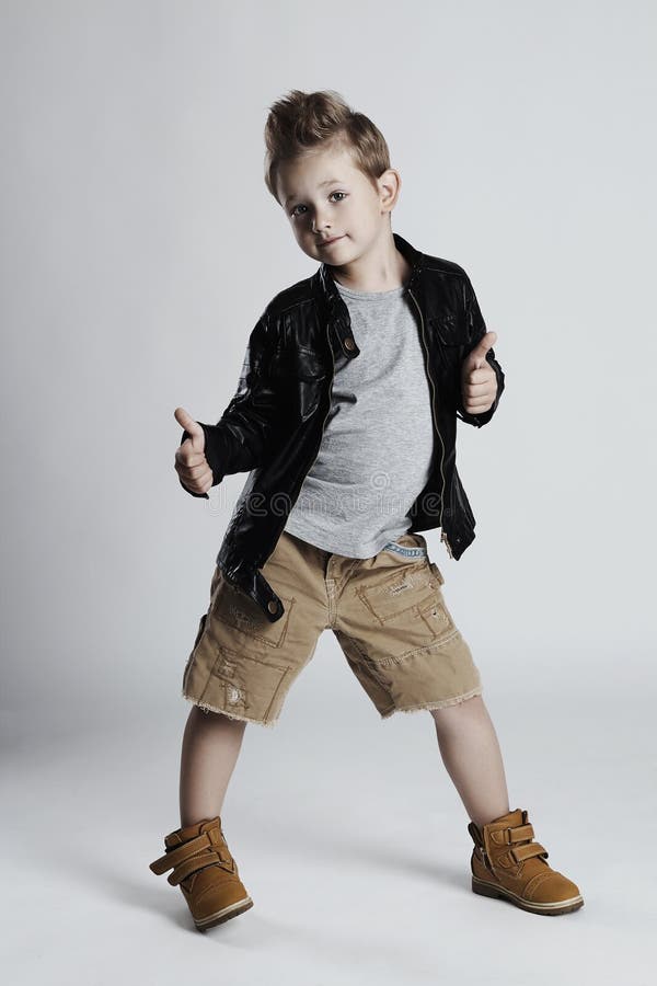 Fashionable Child In Leather Coat. Little Boy Hairstyle 