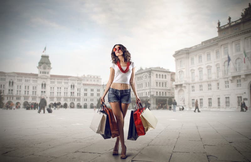 Fashionable girl doing shopping royalty free stock photo