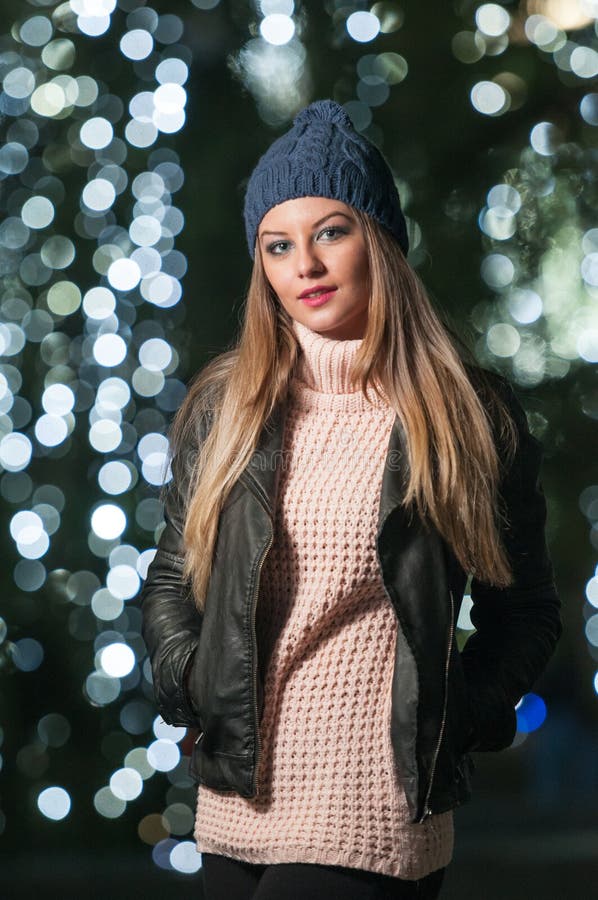 Fashionable Lady Wearing Cap and Black Jacket Outdoor in Xmas Scenery ...