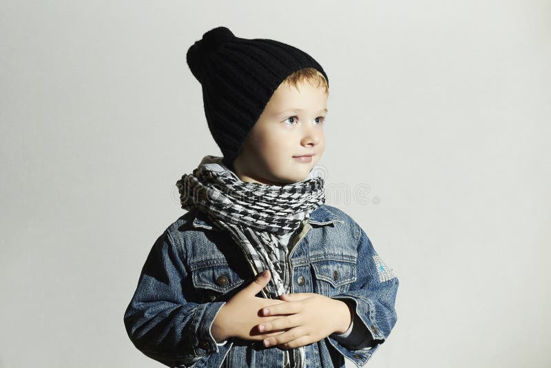 Fashionable little boy in scarf and jeans.winter style.fashion kids.funny child