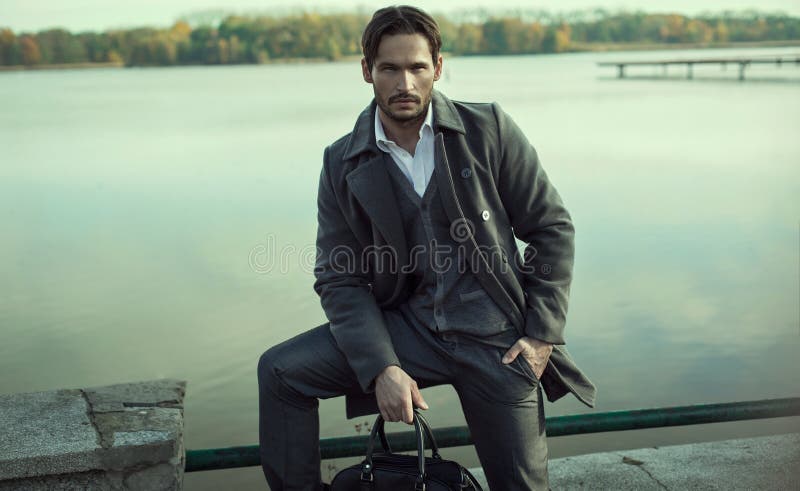 Fashionable man by lake