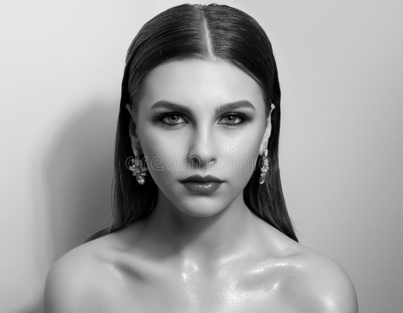 Fashionable portrait of a girl model. Fashion, accessories, evening wet effect makeup. stock photo Fashionable portrait of a girl model. Fashion, accessories, evening wet effect makeup. stock photo
