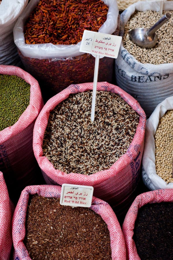 Sacks of wild rice mixes next to different colors of dry beans and other goods in a spice and dry goods store in Nazareth, Israel. Sacks of wild rice mixes next to different colors of dry beans and other goods in a spice and dry goods store in Nazareth, Israel.