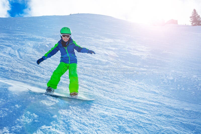 Fast Action Photo of Boy Go Downhill on Snowboard Stock Photo