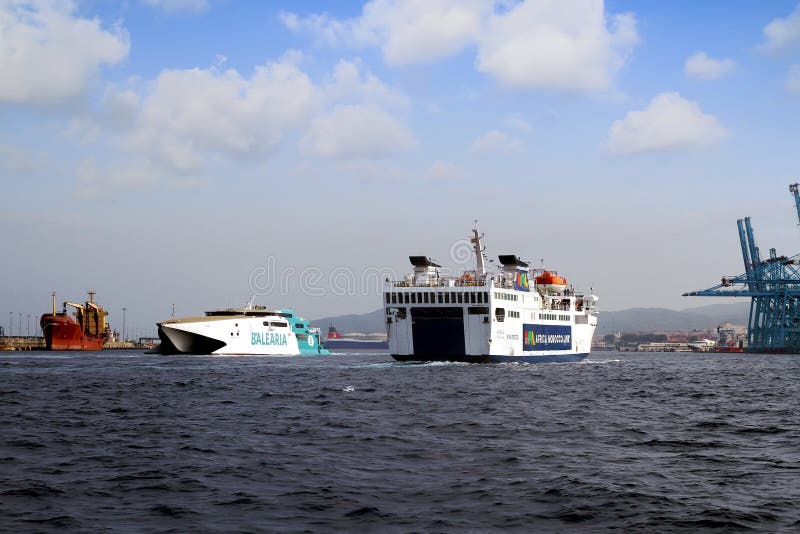 Fast ferry passengers and roro vessel sailing into the port of Algeciras. stock images