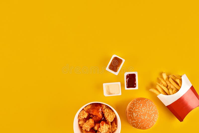 Fast food dish top view. Meat burger, potato chips and wedges. Take away composition. French fries, hamburger. Lettuce, cheeseburger.