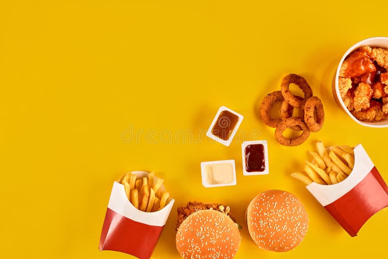 Fast food dish top view. Meat burger, potato chips and wedges. Take away composition. French fries, hamburger. Country, background.