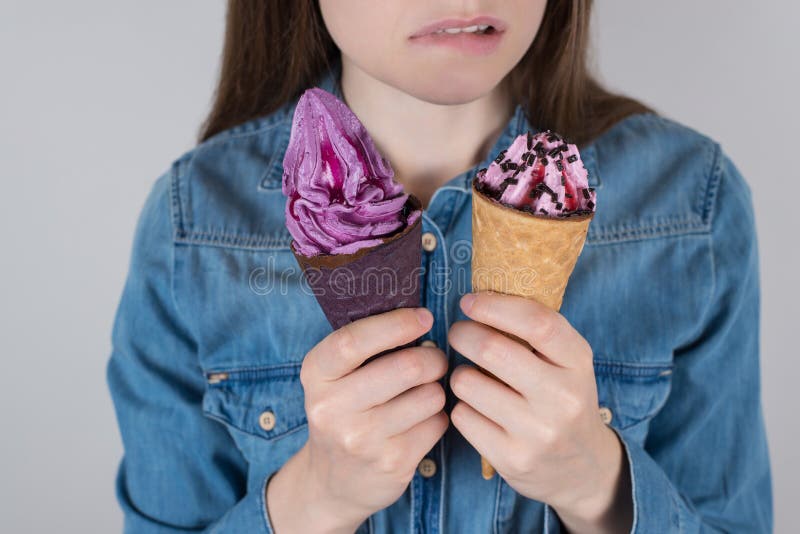 Fast junk high calories food or health care concept. Cropped close up photo of unhappy doubtful hesitating thoughtful dream dreamy stock photography Fast junk high calories food or health care concept. Cropped close up photo of unhappy doubtful hesitating thoughtful dream dreamy stock photography