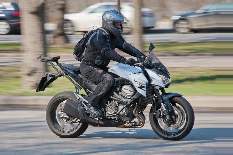 Fast-moving biker editorial image. Image of helmet, outdoor - 45172025