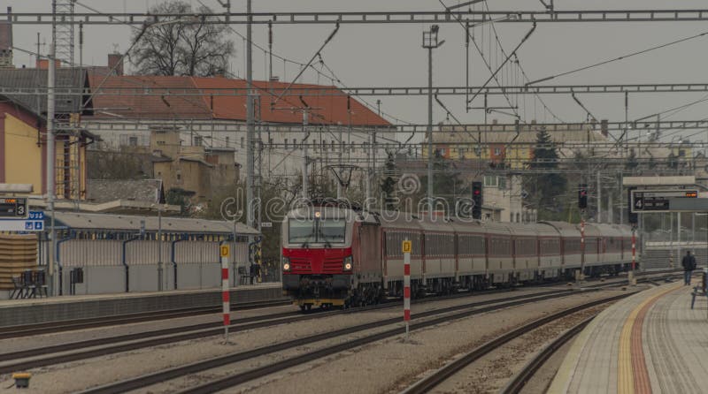 Fast passenger train with red modern electric engine in Ilava station royalty free stock images Fast passenger train with red modern electric engine in Ilava station royalty free stock images
