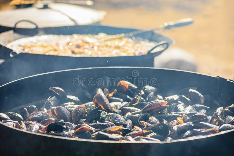 Street food cooking on big frying pan outdoor Stock Photo