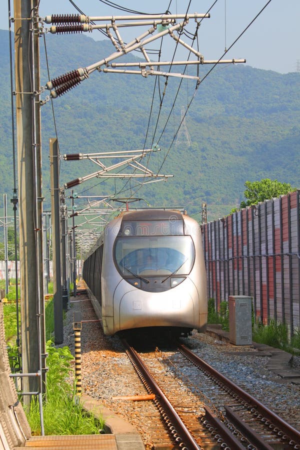 Fast train with passengers in Hong Kong at day