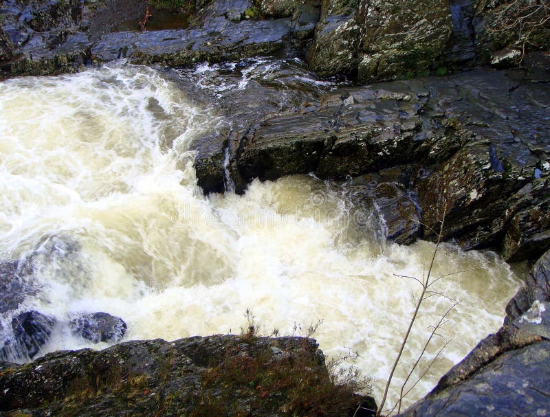 Fast white water, shiny black rocks stock photo Fast white water, shiny black rocks stock photo
