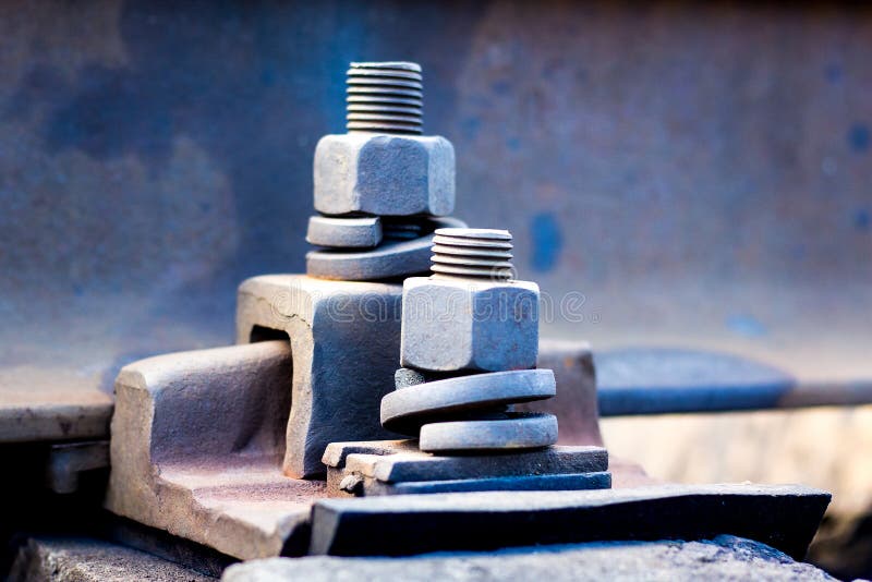Fastening Parts Using Bolts and Nuts on the Railroad Track_ Stock Photo