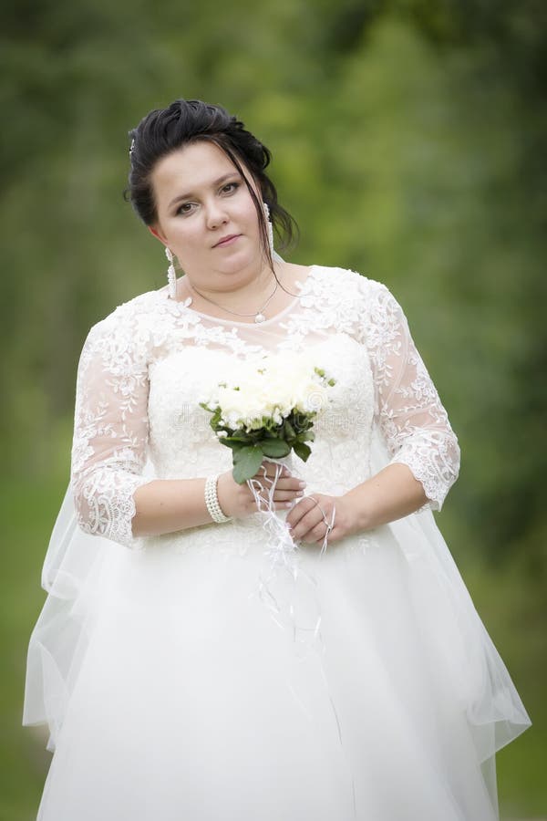 Fat Bride with a Wedding Bouquet Stock ...