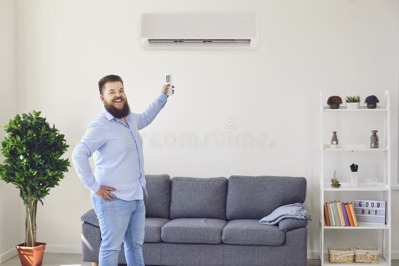 Fat Funny Man Holding an Air Conditioning Control Panel at Home. Air Conditioner. Stock Photo - Image of heat, relaxing: 181492690 Fat Funny Man Holding an Air Conditioning Control Panel at Home. Air Conditioner. Stock Photo - Image of heat, relaxing: 181492690