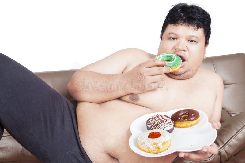 Fat man eating donuts. 