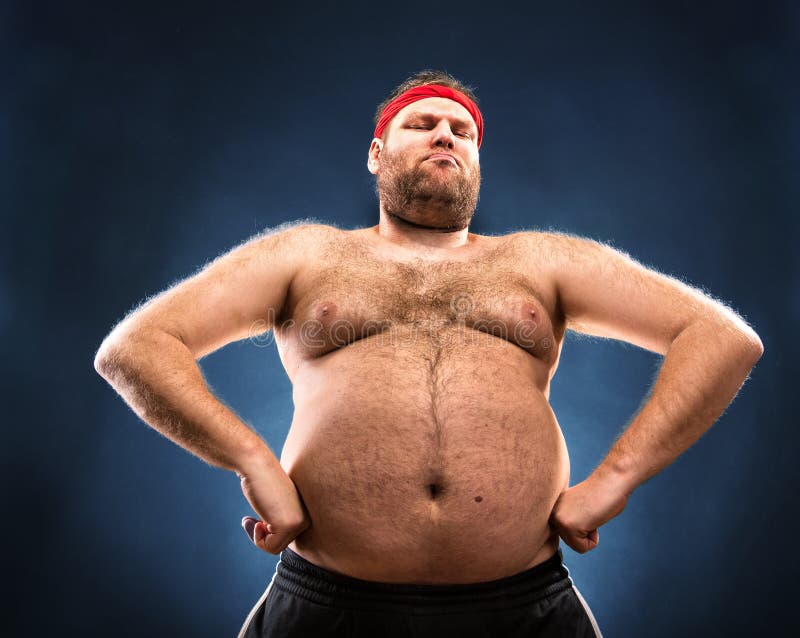 Fat man imitating muscular build.