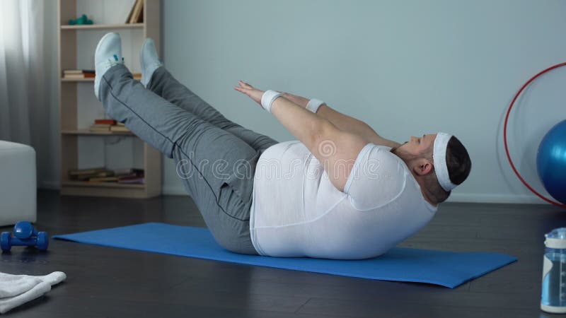 Fat Man Practicing Abdominal Static Exercise Strength and Endurance Development Stock Video Video of exercises obesity 123078295