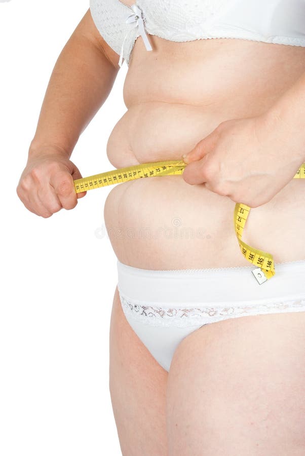 Fat woman measuring her stomach