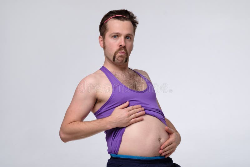 Fat Young Funny Man with a Big Belly is Ging To Do Some Exercises for Core Stock Photo - Image of abdomen, holding: 181813556 Fat Young Funny Man with a Big Belly is Ging To Do Some Exercises for Core Stock Photo - Image of abdomen, holding: 181813556