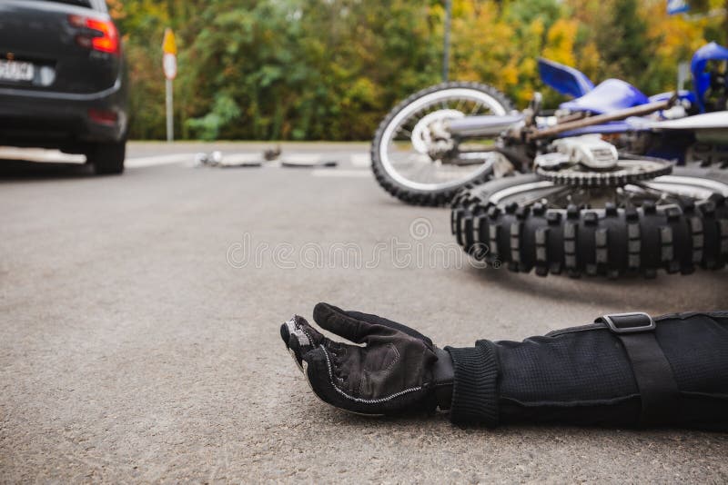 Man on the street after fatal car and motorcycle accident. Man on the street after fatal car and motorcycle accident