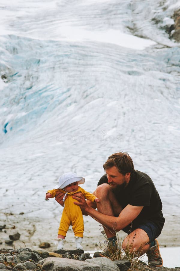 Father and baby child exploring mountains together stock photos Father and baby child exploring mountains together stock photos