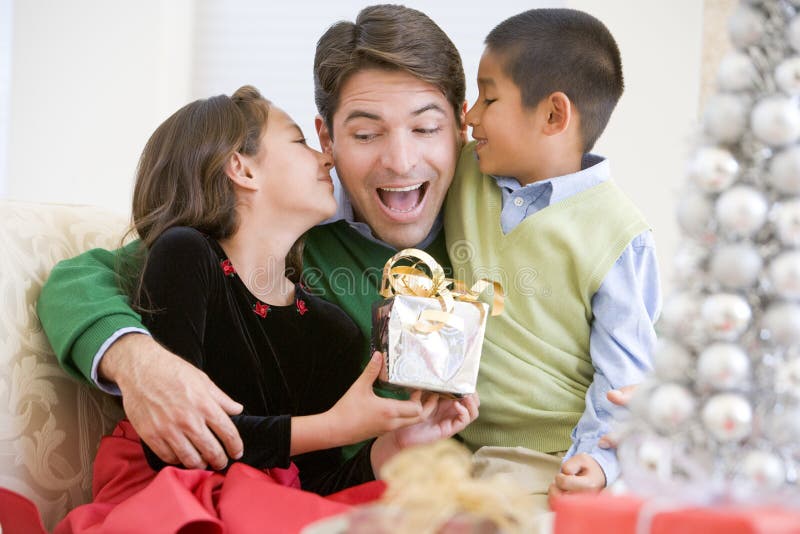 Father Being Given A Christmas Present royalty free stock images Father Being Given A Christmas Present royalty free stock images