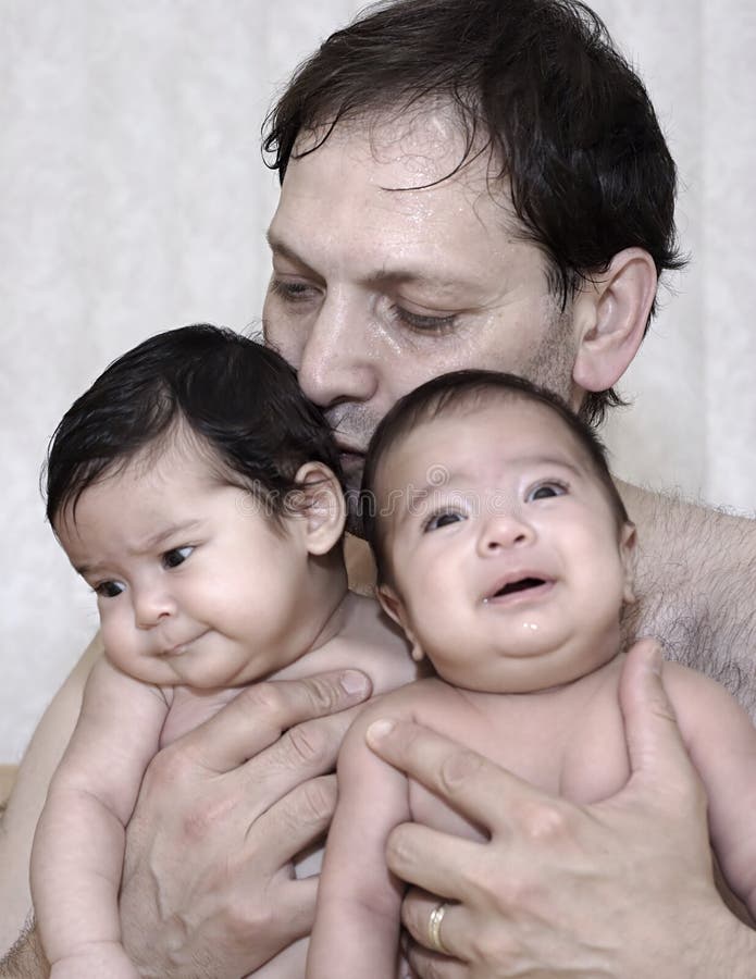 Father Bonding With Baby Twins Stock Image - Image: 540997
