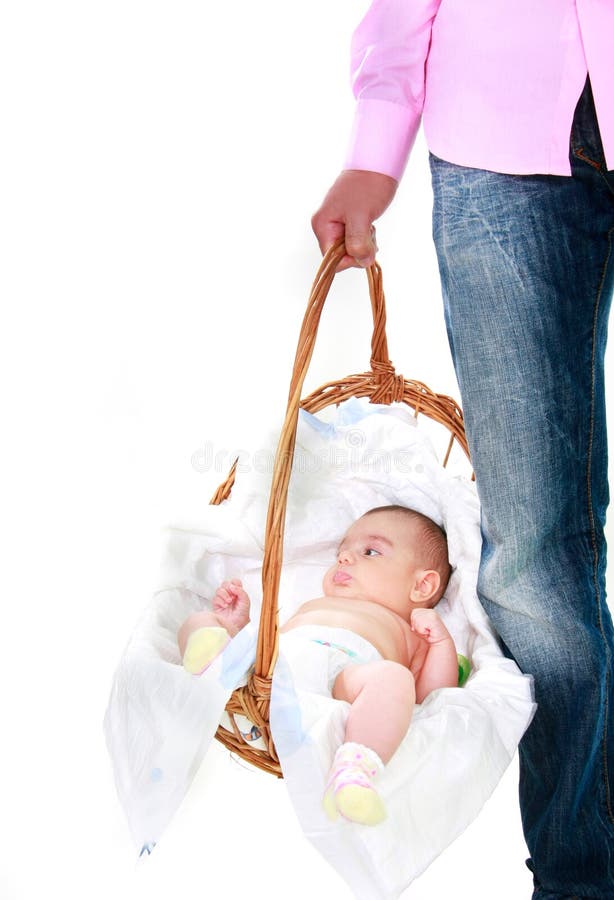 Father carrying baby in basket