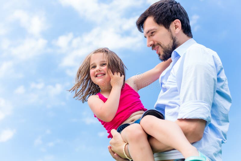 Father Carrying Daughter Protecting Her