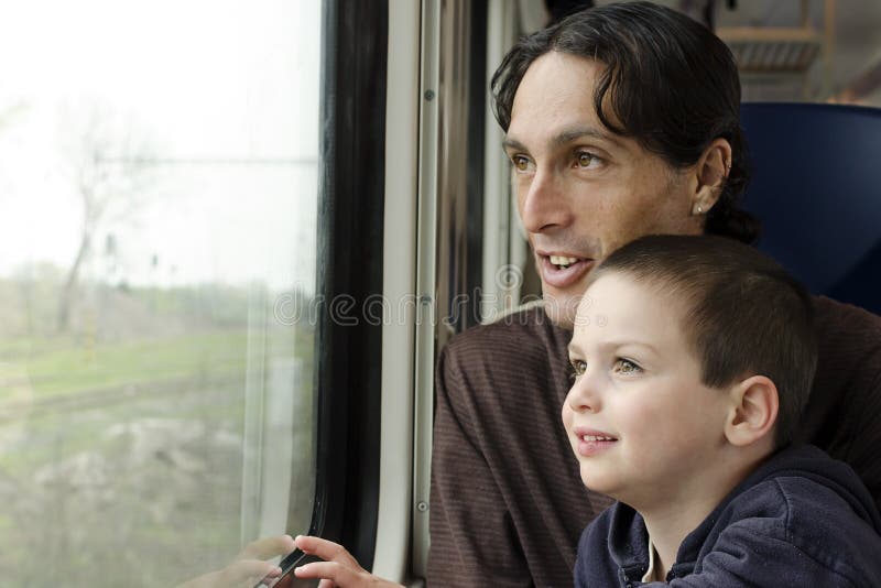 Father and child on train