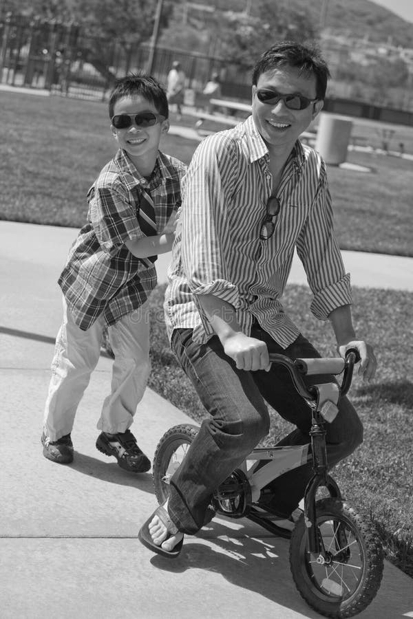 Father on a children bike