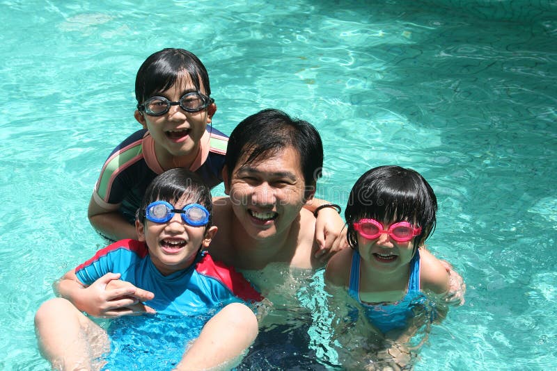 Father and children in the pool