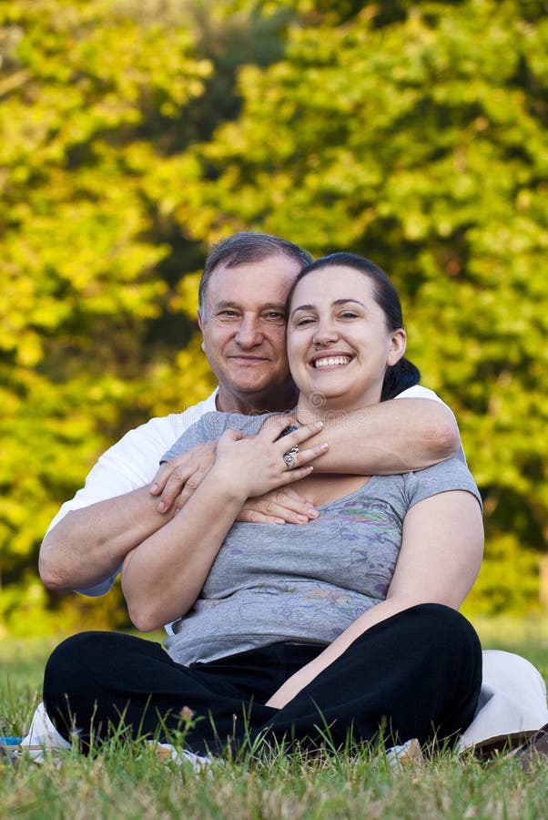 Father and daughter on grass