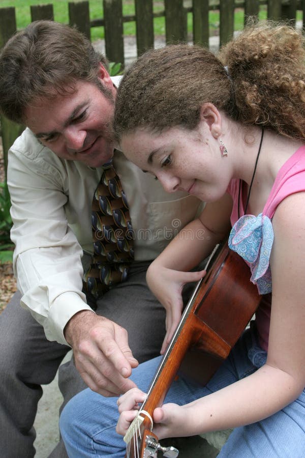 Father Daughter Guitar Lesson 2 stock image Father Daughter Guitar Lesson 2 stock image