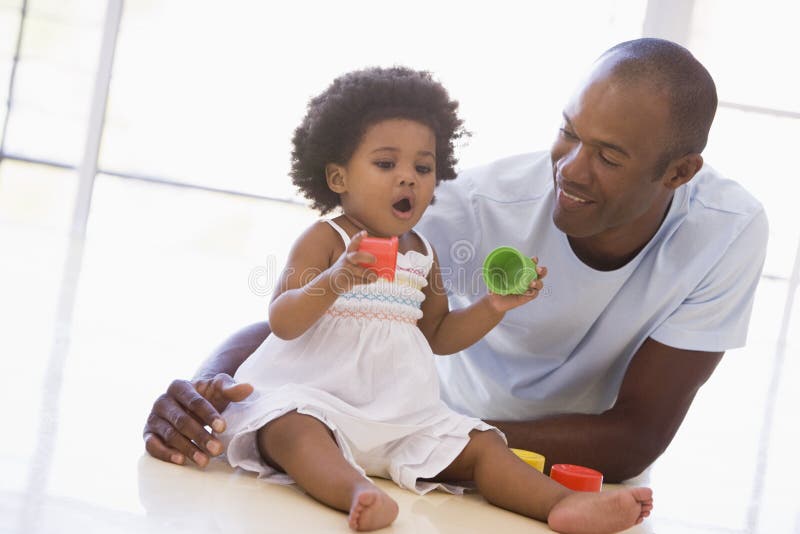 Father and daughter indoors playing stock photography Father and daughter indoors playing stock photography