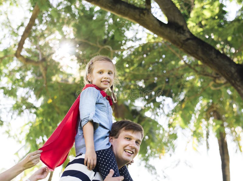 Father and daughter playing superheroes stock image Father and daughter playing superheroes stock image