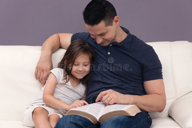 Daddy Reading His Little Girl the Word of God. Daddy Reading His Little Girl the Word of God