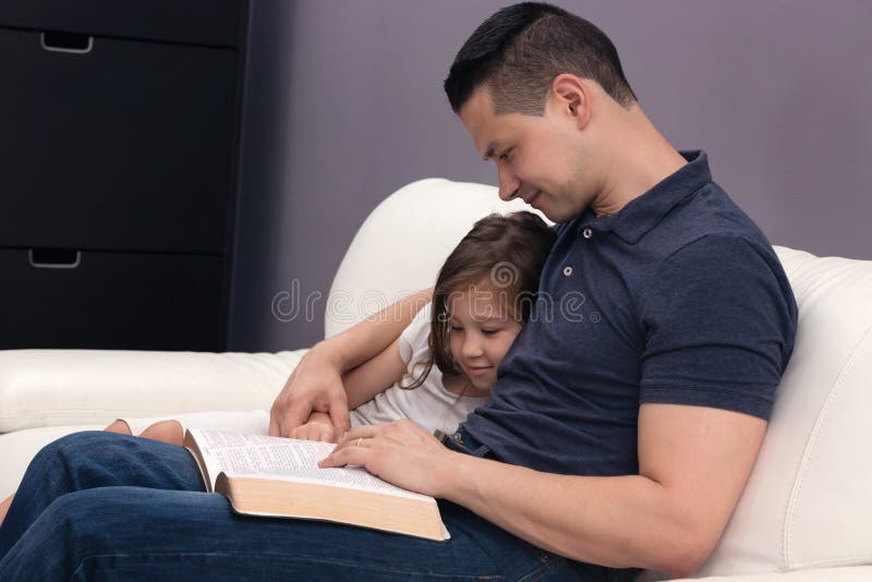 Daddy Reading His Little Girl the Word of God. Daddy Reading His Little Girl the Word of God