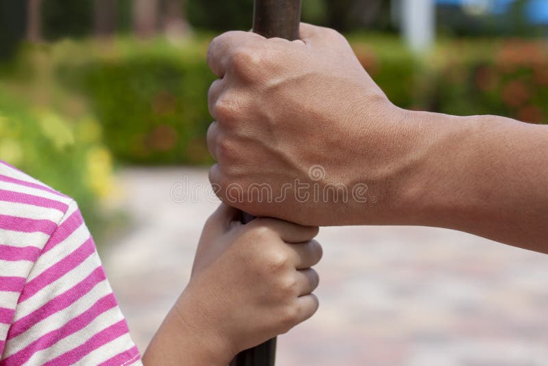 The father is hand is ready to take care and protect the daughter. royalty free stock images The father is hand is ready to take care and protect the daughter. royalty free stock images