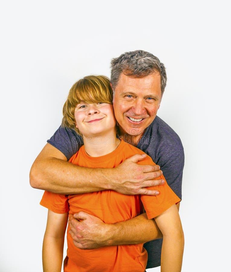 Father and happy son hugging