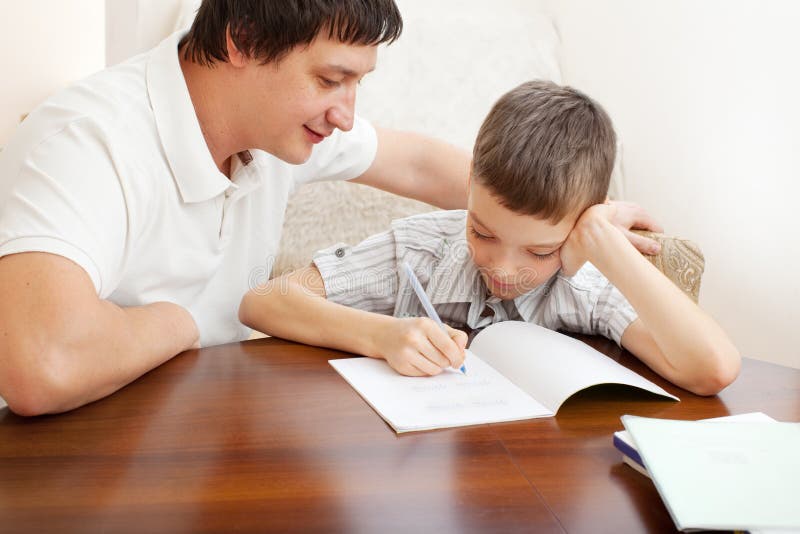 Homework with dad. Homework real. Папа делает уроки с сыном Фотобанк. Отец помогает сыну с уроками. Does your son