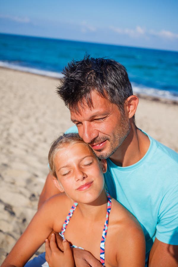 Father and his daughter at beach.