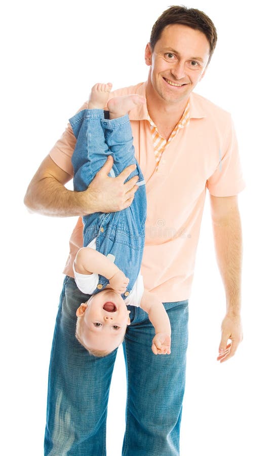 Father Holding His Baby Upside Down Royalty Free Stock Photography