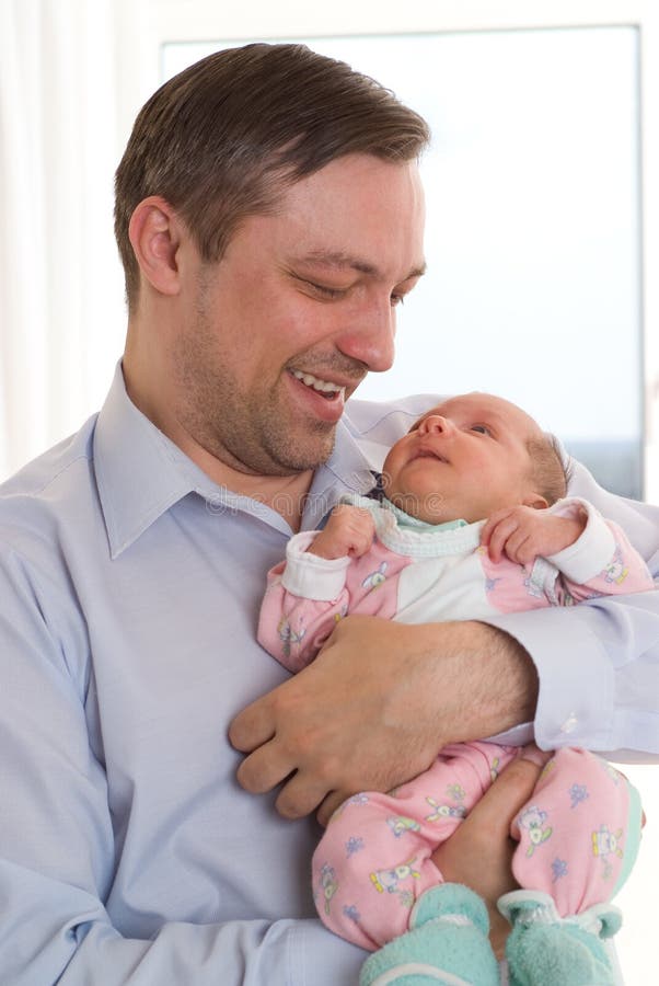 Father holding newborn