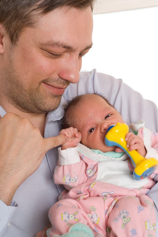 Father holding newborn daughter